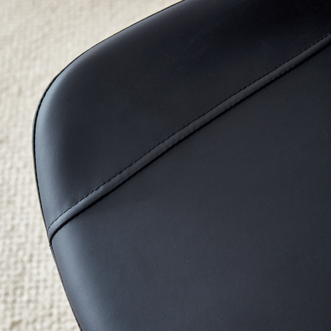 Table and chair set.A minimalist retro rectangular dining table with a specially textured top and black metal legs.Paired With 4 Black Artificial PU Chairs With Curved Widened Cushion Design.