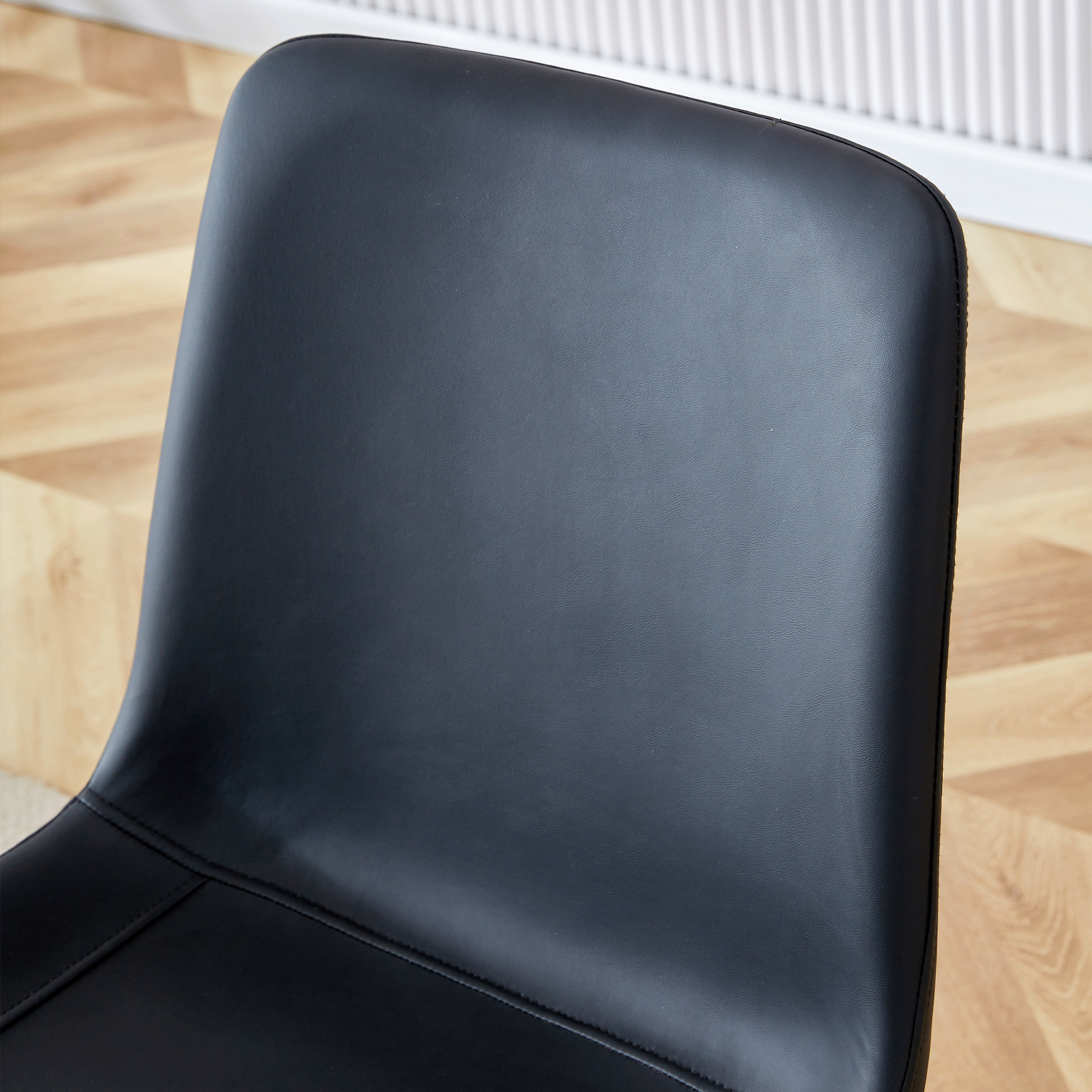 Table and chair set.A minimalist retro rectangular dining table with a specially textured top and black metal legs.Paired With 4 Black Artificial PU Chairs With Curved Widened Cushion Design.