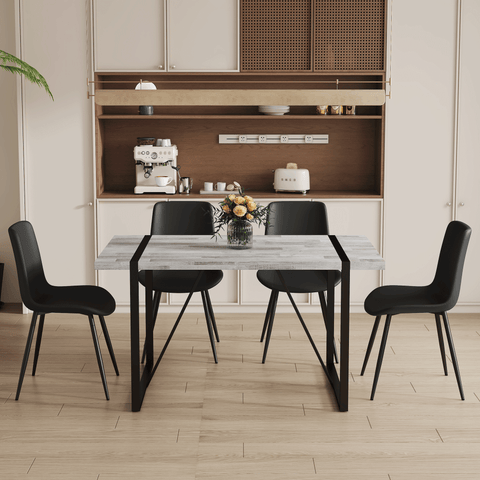 Table and chair set.A minimalist retro rectangular dining table with a specially textured top and black metal legs.Paired With 4 Black Artificial PU Chairs With Curved Widened Cushion Design.